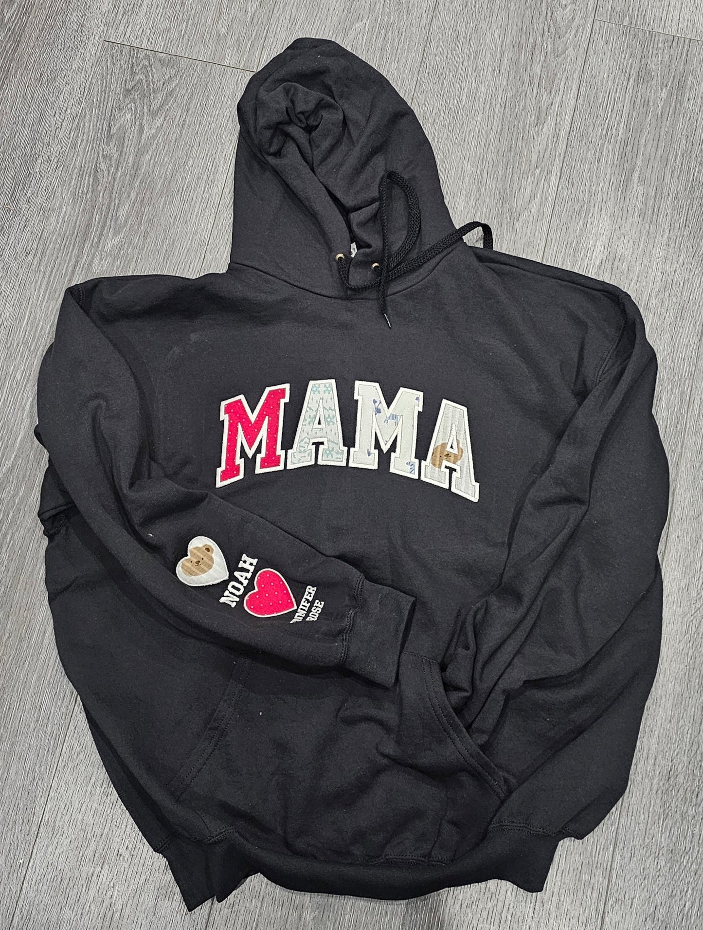 A black hoodie with personalised writing
